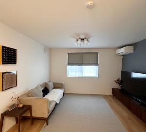 Una cama o camas en una habitación de スカイツリーまで徒步約10分、清潔、快適、便利、静か、設備完備！