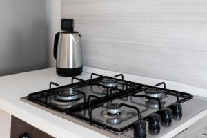 Kuchyň nebo kuchyňský kout v ubytování PARISI - Porto Mantovano Apartment