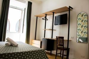Postel nebo postele na pokoji v ubytování Hotel Ciao