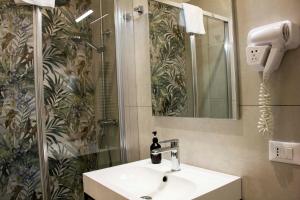 a bathroom with a sink and a shower at Hotel Ciao in Rome
