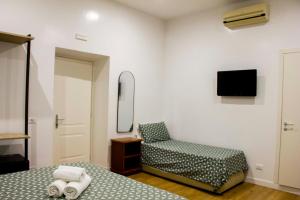 Postel nebo postele na pokoji v ubytování Hotel Ciao