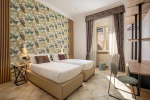 Postel nebo postele na pokoji v ubytování Hotel Ciao