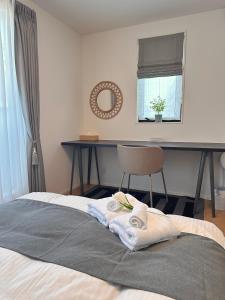 Una cama o camas en una habitación de スカイツリーまで徒步約10分、清潔、快適、便利、静か、設備完備！