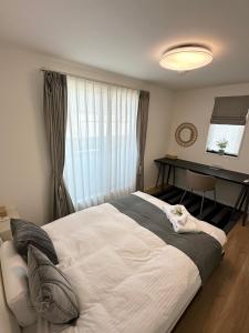 Una cama o camas en una habitación de スカイツリーまで徒步約10分、清潔、快適、便利、静か、設備完備！