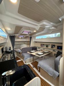 an rv with a kitchen and a living room at La Rochelle sur L'eau in La Rochelle