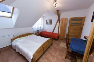 מיטה או מיטות בחדר ב-Aktywna Agroturystyka