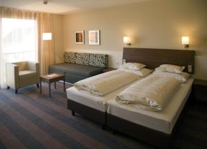 Postel nebo postele na pokoji v ubytování Hotel Gasthof Krönele + 35 fotografií