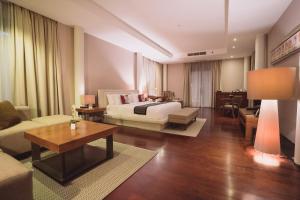 Ein Bett oder Betten in einem Zimmer der Unterkunft Javana Royal Villas