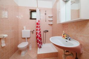 Koupelna v ubytování Rooms Mande