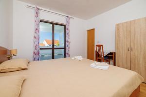 Postel nebo postele na pokoji v ubytování Rooms Mande