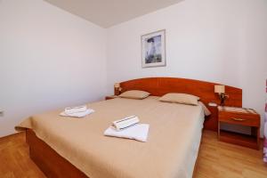 Postel nebo postele na pokoji v ubytování Rooms Mande