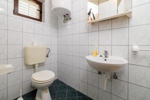 Koupelna v ubytování Rooms Mande