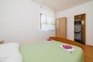 Postel nebo postele na pokoji v ubytování Rooms Mande