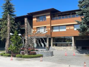 a building with orange cones in front of it at Мия 2 Deluxe Royal Spa in Velingrad