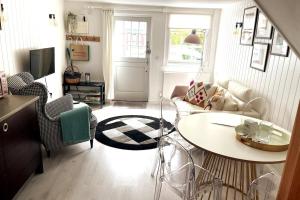 a living room with a couch and a table at LB Newgate in Lymington