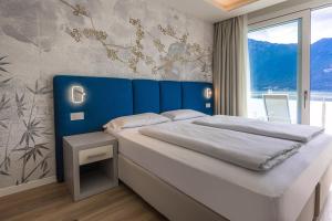 Posteľ alebo postele v izbe v ubytovaní Hotel Ideal