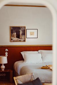 A bed or beds in a room at Capelongue, a Beaumier hotel & Spa