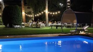 an outdoor event with a group of people sitting at tables at Resort Restaurant Villa Berta in San Severino Marche