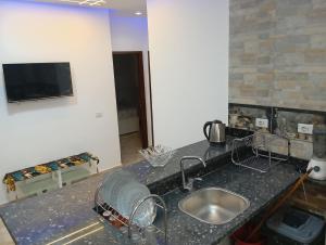 TV a/nebo společenská místnost v ubytování Villamar Sea View rooms & apartments