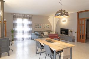 a living room with a table and a couch at il Giardino in Civitanova Marche