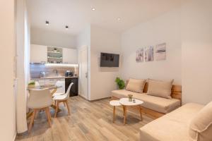 a living room with a couch and a table at Evdokia Luxurious Living in Stavros