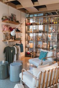 a room with chairs and tables in a store at Hôtel de La Plage in Biarritz