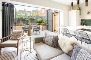 a living room with a couch and chairs and a table at Host & Stay - The School House in Hereford