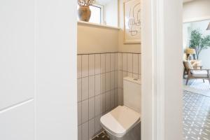 a bathroom with a toilet in a room at Host & Stay - The School House in Hereford