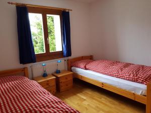 Postel nebo postele na pokoji v ubytování Casa Malanca, Flumserberg