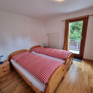 Postel nebo postele na pokoji v ubytování Casa Malanca, Flumserberg