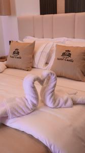 Postel nebo postele na pokoji v ubytování Hotel Castle