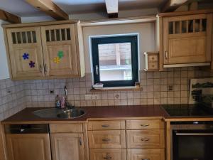 Kuchyň nebo kuchyňský kout v ubytování Bichlhaus Appartements