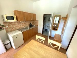 Kuchyňa alebo kuchynka v ubytovaní Úzkokolejky - apartmány Kunžak - Lomy + 7 fotografií