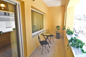 a room with a table and chairs and a window at Elena's nest in Kastoria