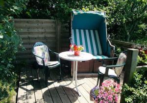 a table and two chairs sitting on a patio at Ferienwohnungen Rosenträger in Kappeln