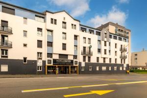 an empty street in front of a building at Logis Hotel Center in Brest