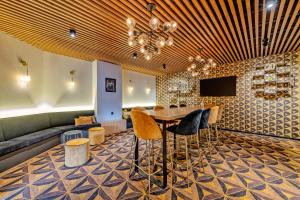 a dining room with a table and chairs at Logis Hotel Center in Brest