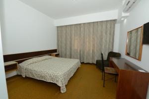 Postel nebo postele na pokoji v ubytování Rivoli Hotel Jerusalem