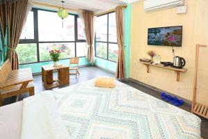TV a/nebo společenská místnost v ubytování Sunny Hanoi Homestay