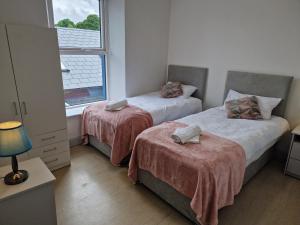 Postel nebo postele na pokoji v ubytování Trivia House