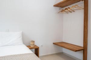 Postel nebo postele na pokoji v ubytování Alia Andros