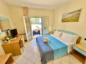 Postel nebo postele na pokoji v ubytování Hotel Alizé