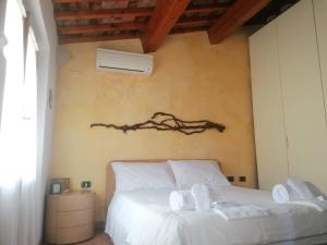 Postel nebo postele na pokoji v ubytování benvenuti al piccolo mulino