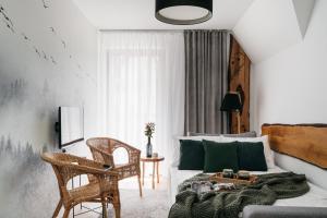 a living room with a couch and a table at Pod Gubałówką - LoftAffair in Zakopane