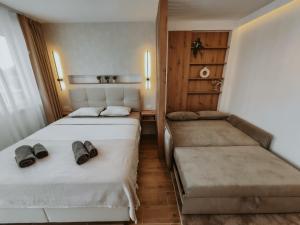 Postel nebo postele na pokoji v ubytování A2 Silver