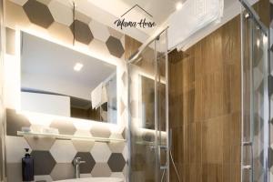 a bathroom with a shower and a sink at Mama House Cenisio in Milan