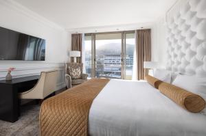 a hotel room with a large bed and a desk at Pepperclub Hotel in Cape Town