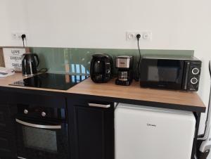 Kuchyňa alebo kuchynka v ubytovaní Jolie Maison en Bord de Mer à Pourville