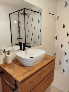 a bathroom with a white sink and a mirror at Milion Destiny Entre Playas in Oropesa del Mar +39 photos