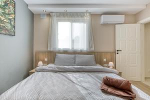 a bedroom with a large bed and a window at Luxury Sliema Stay with Sea Views-Apt14 in Sliema